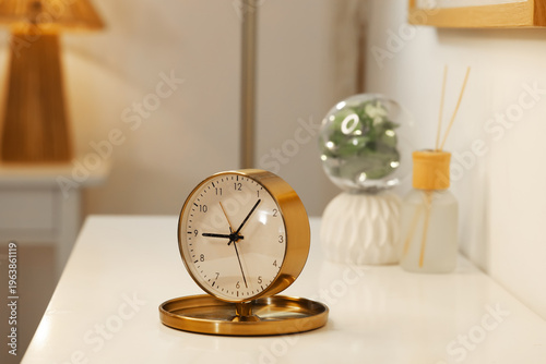 Clock on table in light room