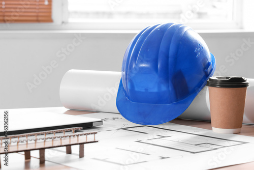 Hardhat with coffee cup and...