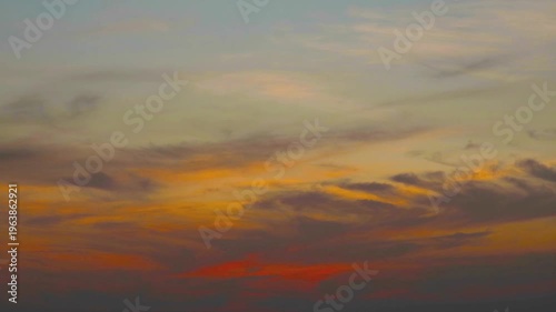 Dramatic Sunset with Yellow, Orange, and Red Tones Glowing in the Sky During Twilight Hour