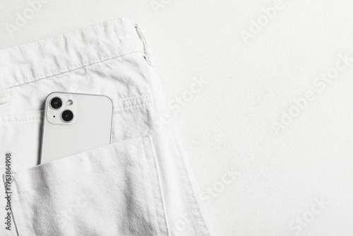White jeans with mobile pho...