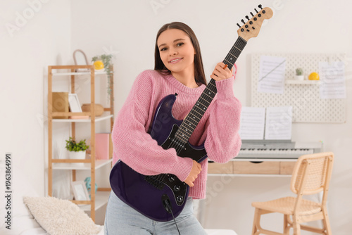 Young girl with electric gu...