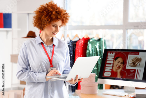 Redhead female seller worki...