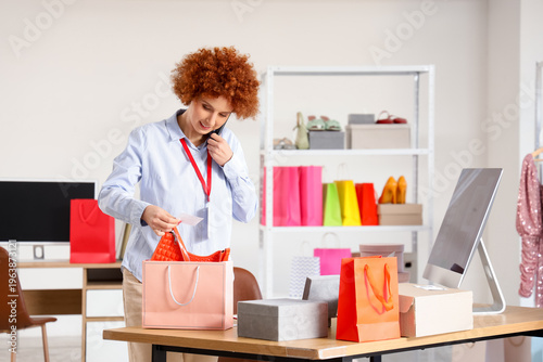 Redhead female seller packi...