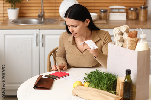 Young woman with receipt an...