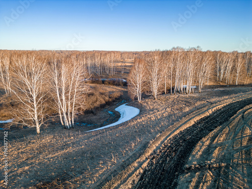 Quadro em tela Aerial view of fire protection measures against spring grass burning with plowed