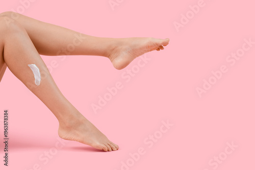 Legs of woman with cream on...