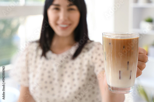 Young woman with glass of i...