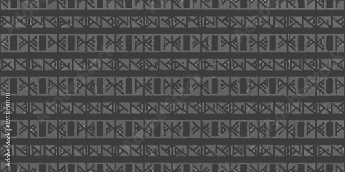 Abstract geometric pattern of dark gray shapes on a black background