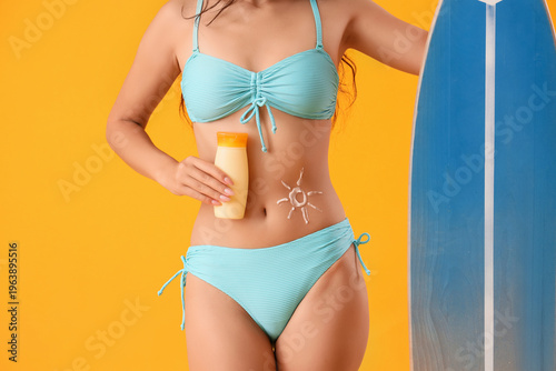 Young woman in swimsuit wit...
