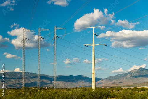 USA, Arizona, Tucson.  High voltage transmission lines tower over the landscape south of the city.