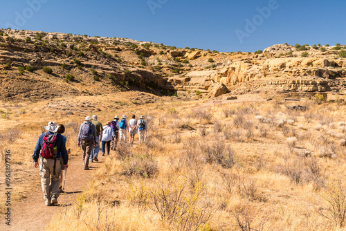 USA, New Mexico, Chaco Canyon.   A hiking tour heading towards Casa Rinconada, ancestral Puebloan archaeological site.