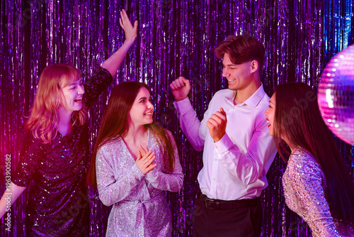 Young people dancing on pro...