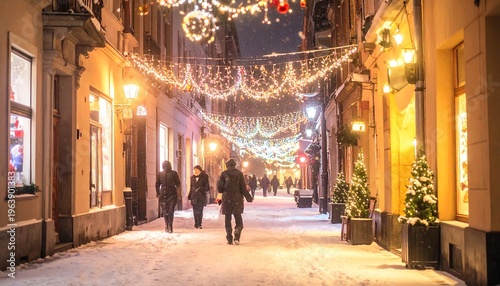 A snow-covered street illuminated by festive lights and shop windows, with people strolling along the sidewalks. It's a winter night