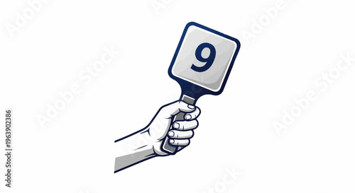 A hand holds up a score paddle with the number nine