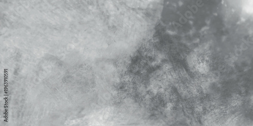 Gray concrete wall surface with distressed texture and blurred light