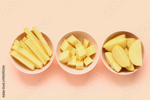 Bowls with pieces of raw po...