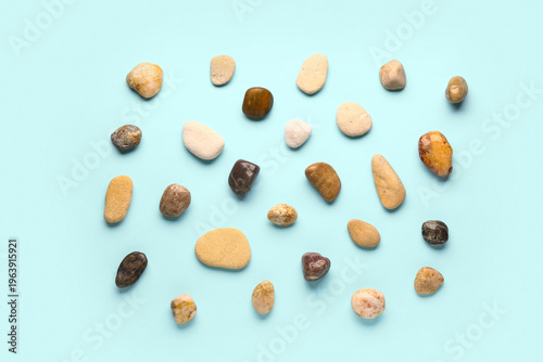 Many pebble stones on blue ...