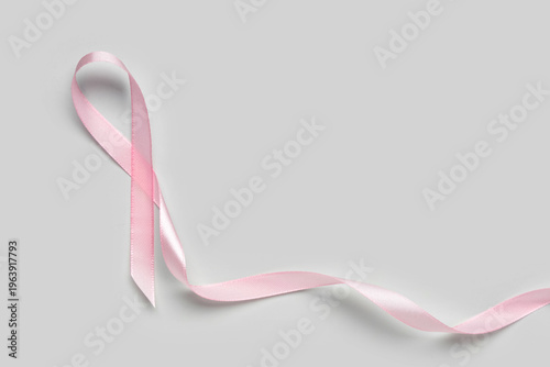 Pink satin ribbon on white ...