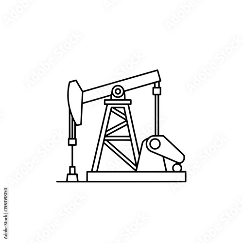 An oil pumpjack operates in an industrial field at sunset