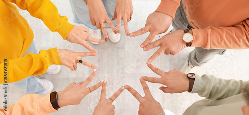 Group of people putting han...