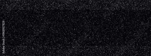 Black background with scattered white and grey grainy noise particles