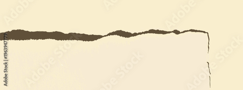 Torn paper edge over cream background with dark brown texture