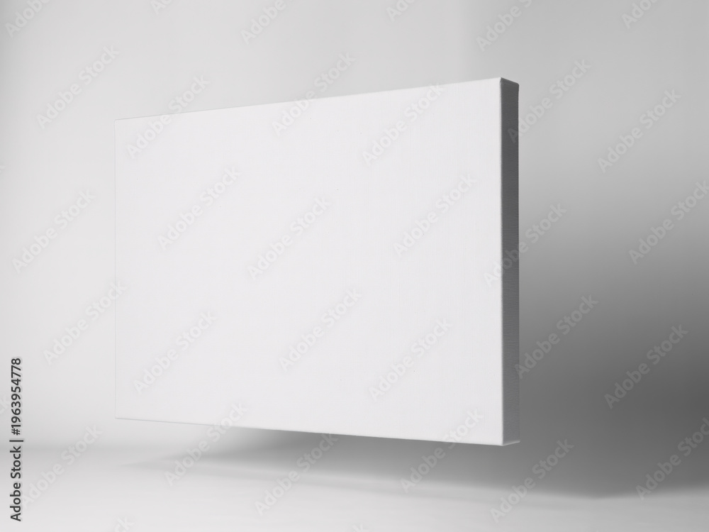 Fototapeta premium A blank white canvas leaning against a wall in a modern studio with soft lighting