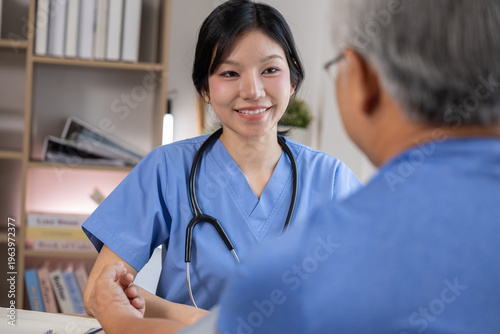 Nurse doctor patient medical consultation hospital clinic healthcare stethoscope uniform Friendly nurse doctor talking with patient during medical consultation hospital clinic healthcare setting