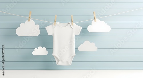 Baby clothes hanging on a line with clouds, nursery decor