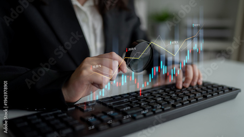 Cuadro en lienzo A business professional closely examines financial data on a keyboard, using a magnifying glass to gain insights into stock market fluctuations and trends