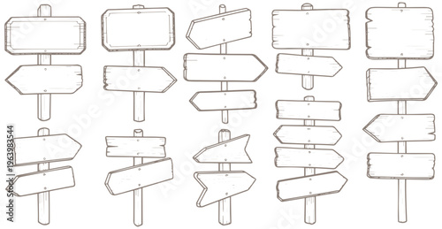 Set of blank directional signs on wooden posts for navigation and guidance