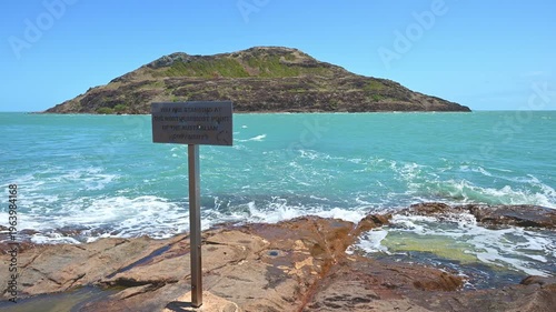 slow motion of you are standing at the northernmost point of the australian continent sign at the tip of Cape York along the coastline of the torres strait in tropical north Queensland, Australia.