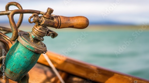 tiller. A worn wooden tiller connected to a ship's rudder on a small sailboat. mobility guides, transit brochures, designed for transport & logistics marketing, used by policy analysts.