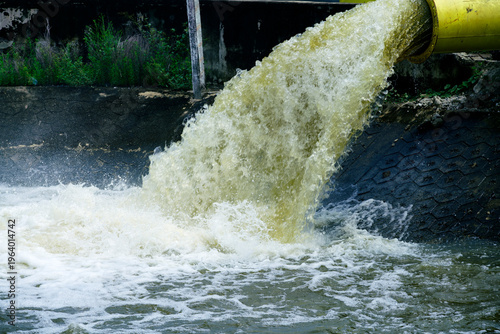 Industrial Wastewater Discharge into a River from a Pipe
