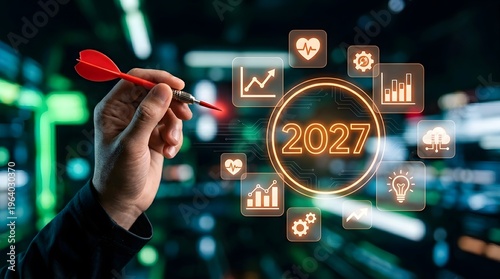 A hand holding a dart aiming at a glowing target with the year 2027 and various business icons in the background.