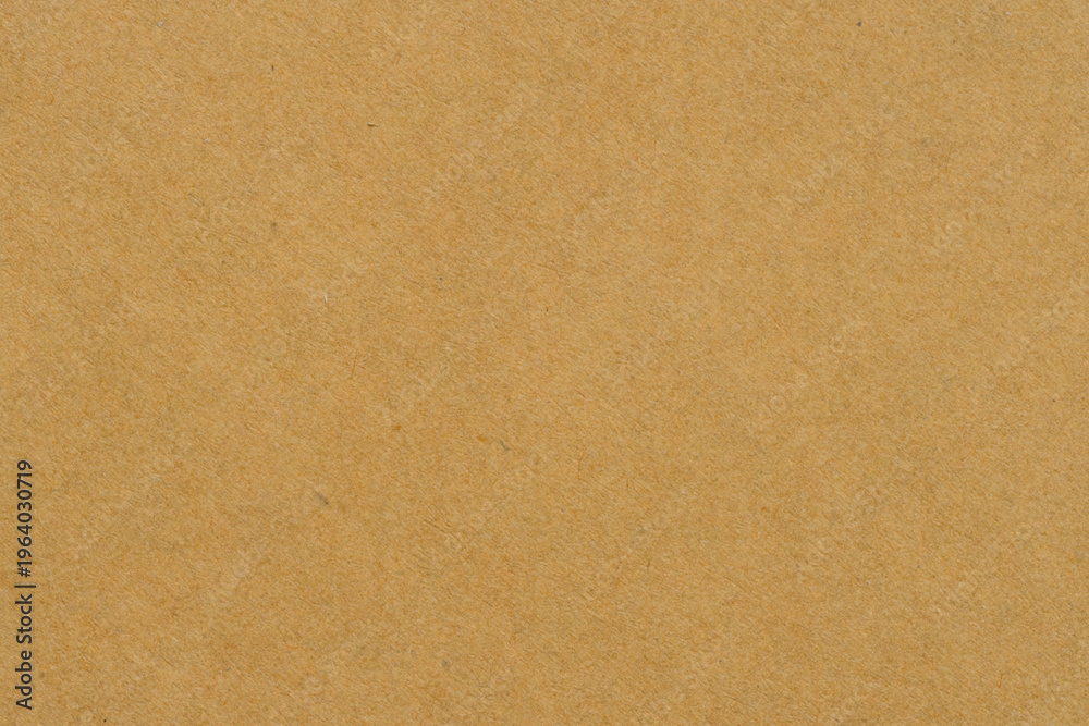 Fototapeta premium Brown Kraft Paper Texture Background with Natural Organic Fiber,Close-up of recycled brown kraft paper texture background, showing natural organic fiber and grainy detail. Ideal for eco-friendly.