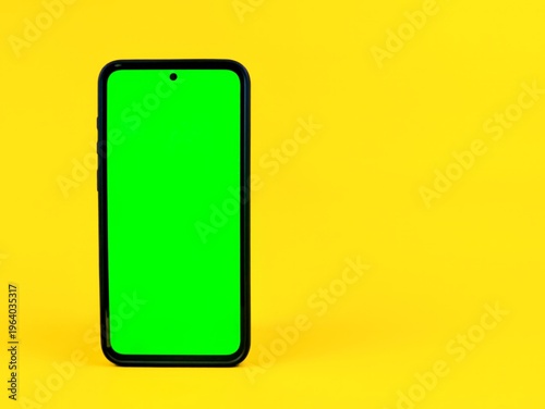 Free Download A close-up shot of a smartphone with a green screen isolated on yellow background. - GFXLoad