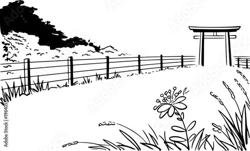 Black and white of a traditional Japanese torii gate and fence in a grassy field