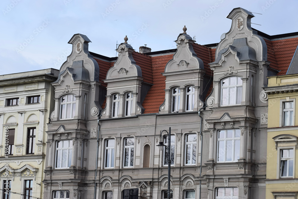 Fototapeta premium Ornate historic building facade with mansard roof and decorative elements