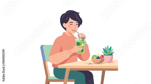 Young man enjoying a refreshing green drink at a table.