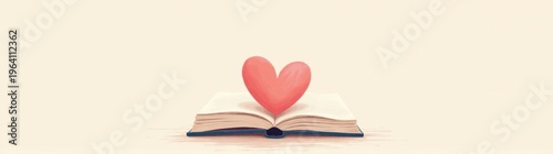 Heart shaped object on top of an open book