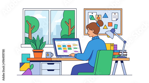 Young woman working diligently on her laptop at a desk.