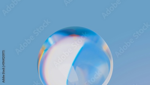 Minimalist clear glass sphere on light blue background
