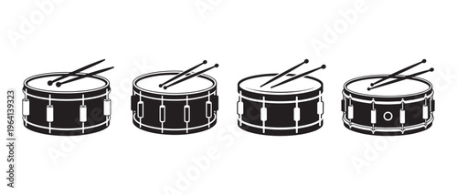 A collection of four black and white snare drum icons with drumsticks on a white background.