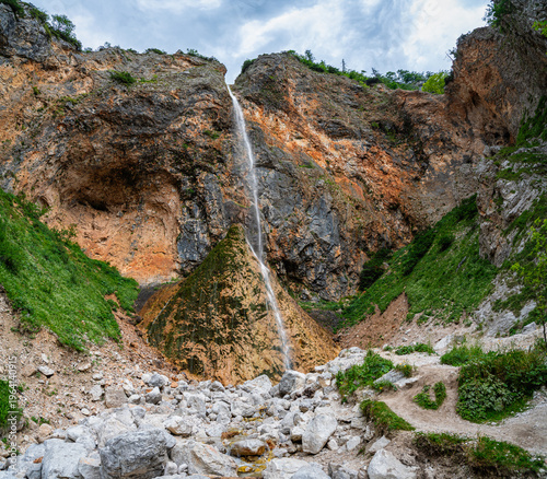 Rinka waterfall in the beautiful Logar Valley in Slovenia during summertime.