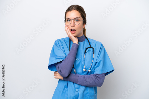 Schilderij op canvas Young caucasian nurse woman isolated on white background surprised and shocked w