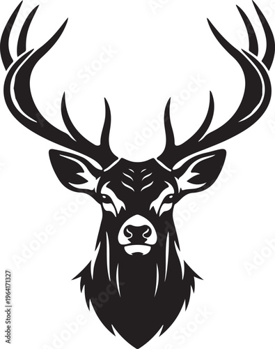 A majestic deer with large antlers stares forward boldly.