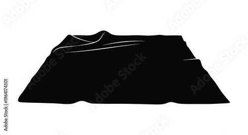 Dark fabric draped over an object creating a striking silhouette