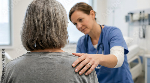 Female healthcare professional comforting senior woman with hand on shoulder during appointment.