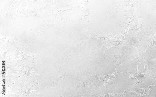 A white color old concrete or plastered wall surface featuring, splatters, and minor stains, indicating wear and age. It serves as a grunge or vintage background texture.